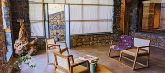 Experience remote stone cottage part of farm stay by the lake amidst raw nature.