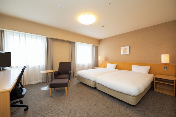 Down comforters, desk, laptop workspace, blackout drapes