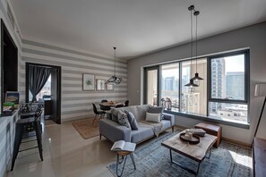 Living area - Spacious 1B with Balcony Overlooking City Views (Dubai)