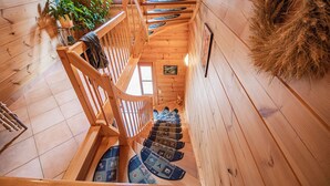 A wooden staircase with a handrail, leading to a lower level. - Apartment 'Horizonte' with Balcony and Wi-Fi (Oberkirch)