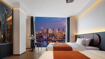 Premium bedding, down duvets, pillow-top beds, in-room safe