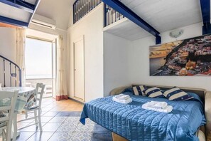 Comfort Quadruple Room | Living area | 32-inch flat-screen TV with digital channels - Captain Mike (Meta)