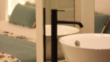 Deluxe Room, Patio | Bathroom | Shower, hair dryer, towels, soap