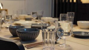 A dining table with various glassware and bowls. - Stylish Itaewon Getaway | Spacious Living, Projector, 4 Beds, 5 min to Station (Seoul)