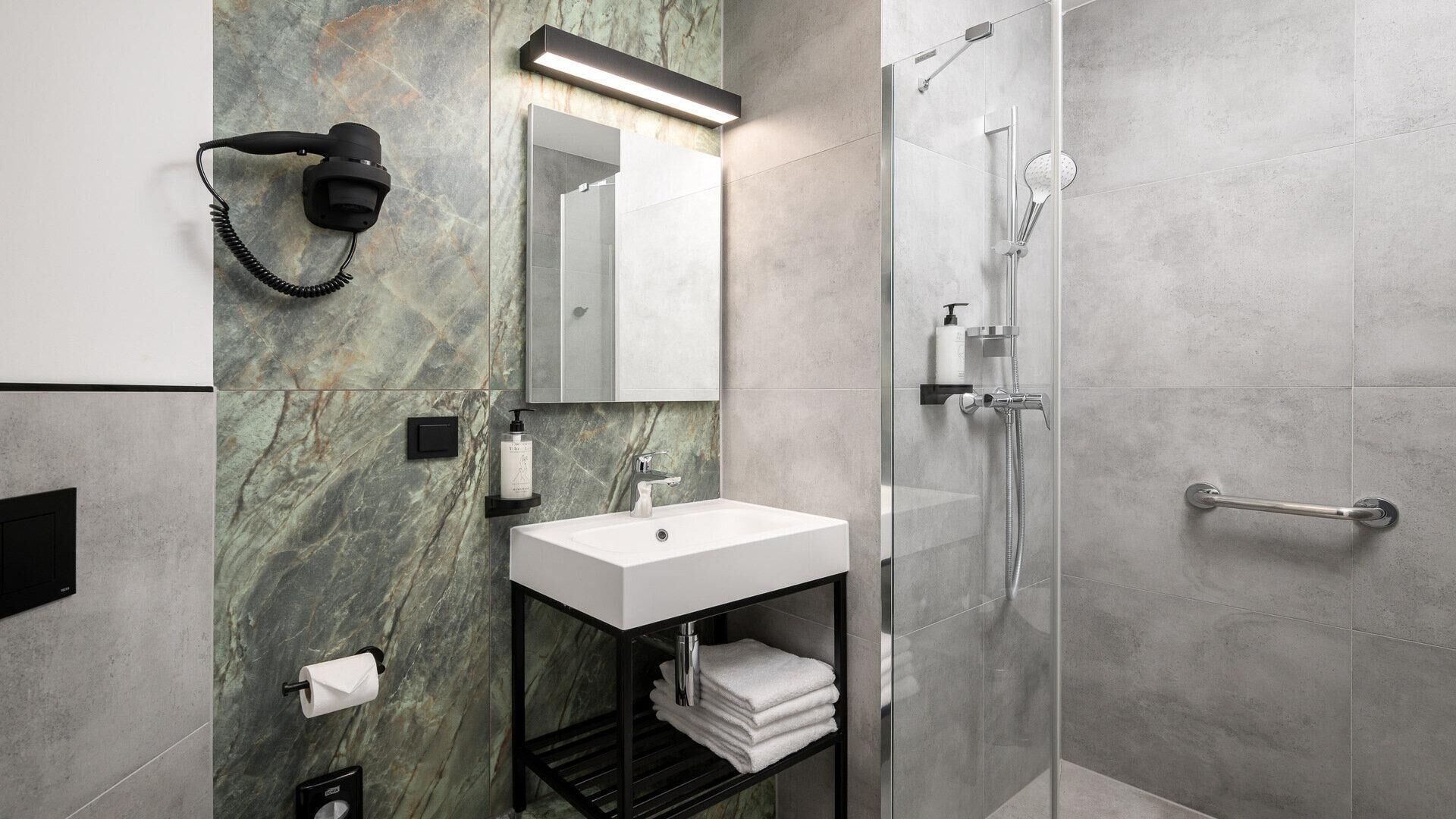Shower, hair dryer, towels, soap