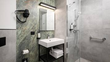 Shower, hair dryer, towels, soap