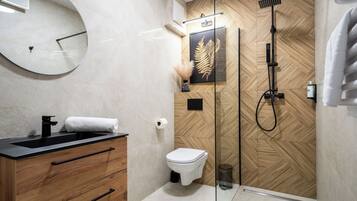 Family Apartment, Balcony, City View | Bathroom | Shower, hair dryer, towels, soap