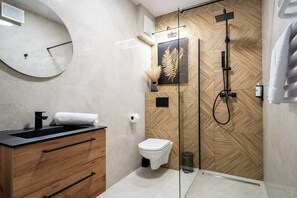 Family Apartment, Balcony, City View | Bathroom | Shower, hair dryer, towels, soap - Pileckiego Residence (Warsaw)