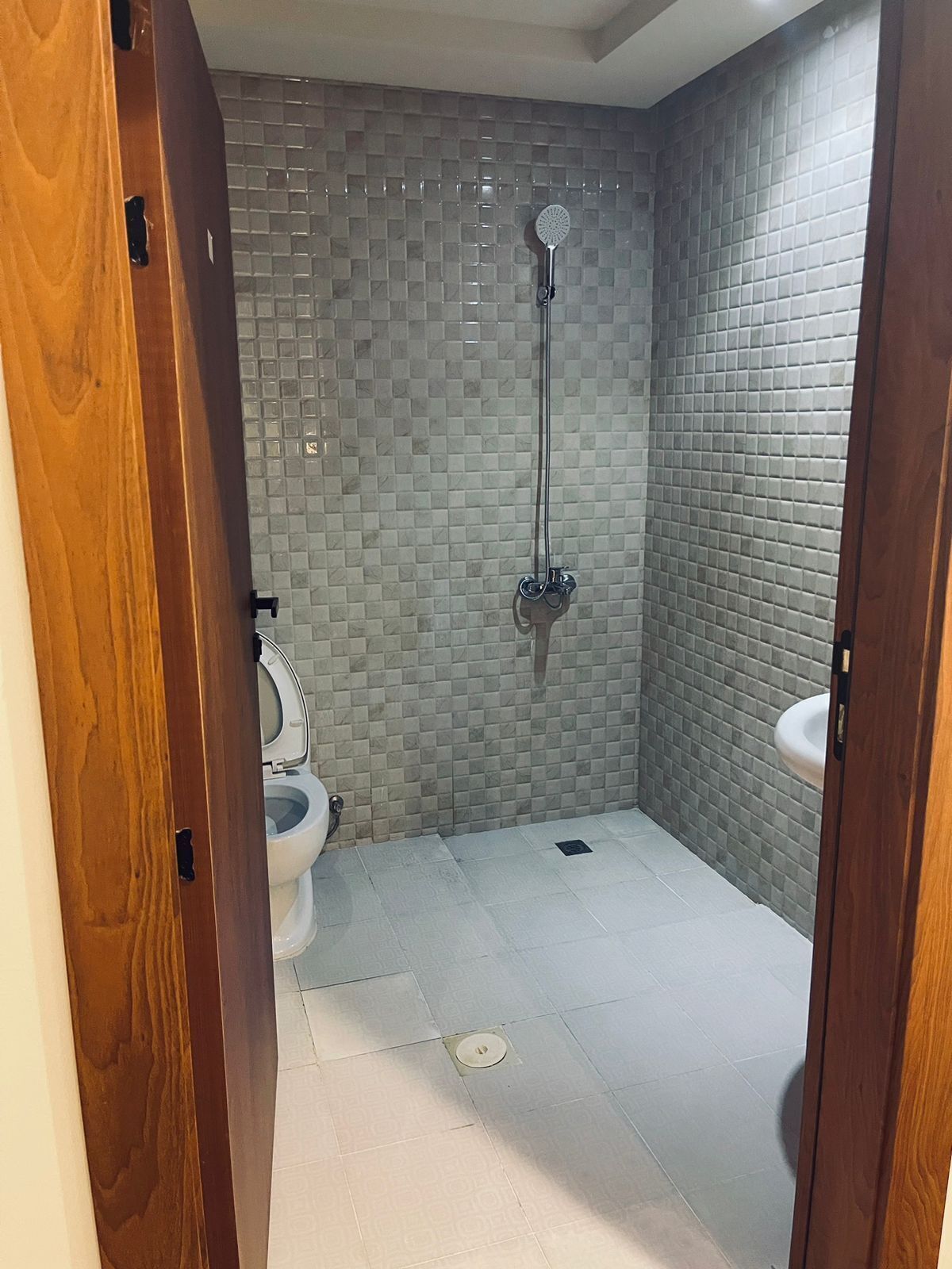 Shower, hair dryer, slippers, towels