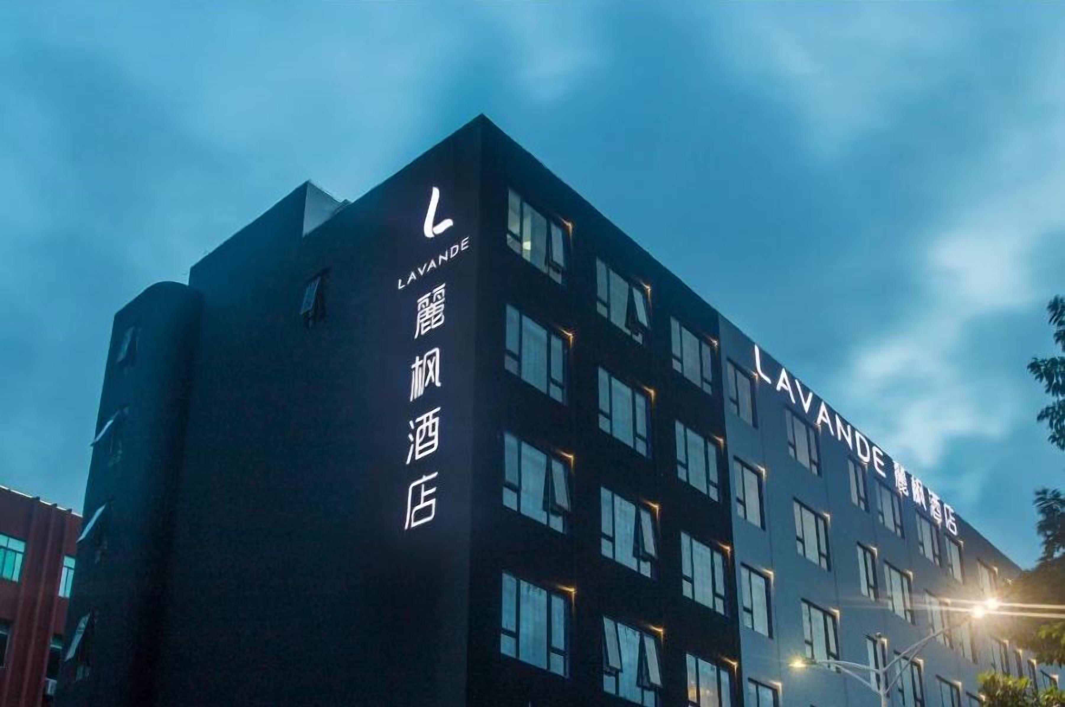 A building with the name 'LAVANDE' prominently displayed on the facade, featuring a modern architectural style with multiple windows.