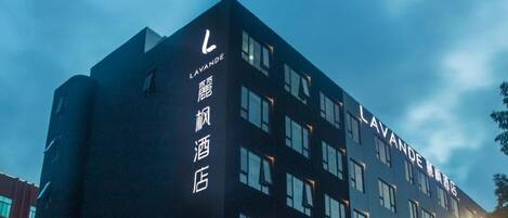 A building with the name 'LAVANDE' prominently displayed on the facade, featuring a modern architectural style with multiple windows.