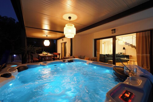 Spacious house in charming Sukošan with Heated Pool, Jacuzzi and Bikes