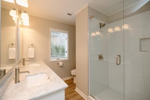 Shower, hair dryer, towels, shampoo