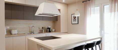 Fridge, stovetop, electric kettle, toaster