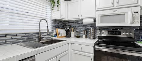 Condo, 2 Bedrooms | Private kitchen | Fridge, oven, coffee/tea maker, toaster