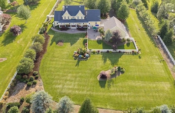 Spacious backyard perfect for lawn games, outdoor entertaining, and family fun—keep an eye out, bison sometimes wander up to the back fence for a truly wild experience!