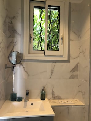 Shower, hair dryer, towels, soap