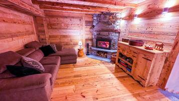 Family Apartment, 3 Bedrooms, Mountain View | Living area | Fireplace, ping pong, books