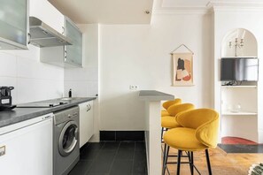 Fridge, microwave, stovetop, coffee/tea maker