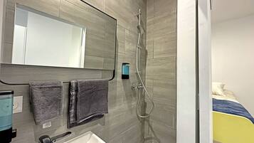 Shower, towels, soap, toilet paper