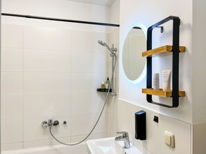 Shower, hair dryer, towels, soap