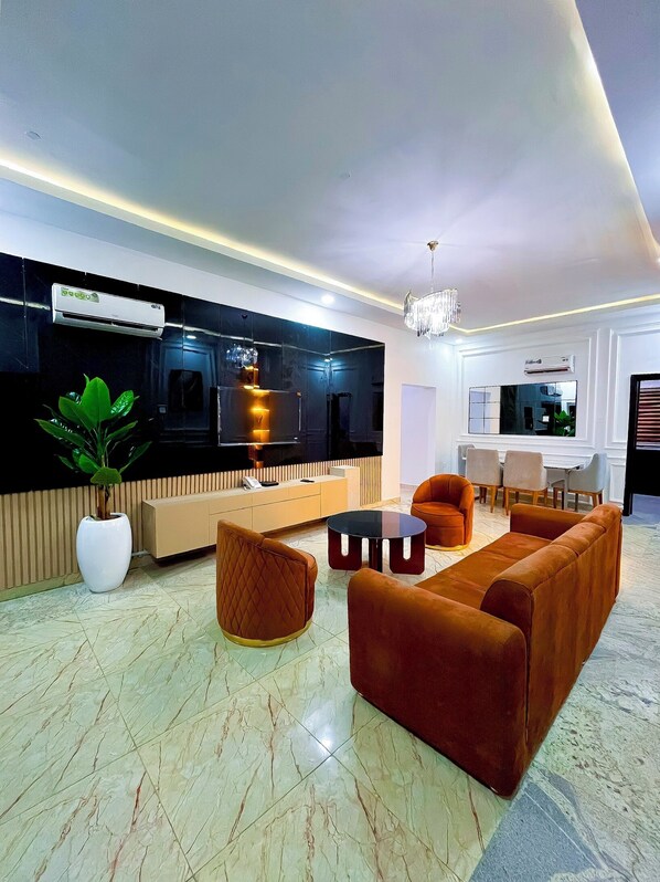 Standard Apartment, Balcony | Living area | 40-inch Smart TV with satellite channels, Netflix, streaming services - The12 by Naji Resort (Abuja)