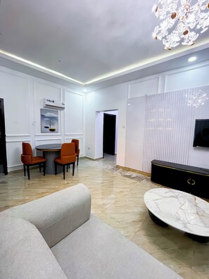 Luxury Apartment, Balcony | Living area | 40-inch Smart TV with satellite channels, Netflix, streaming services - The12 by Naji Resort (Abuja)
