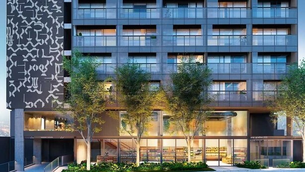 A modern multi-story building with a patterned facade, large windows, and a ground-level retail space. - Vossa Bossa Pop Pinheiros (São Paulo)