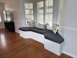 Relax in this inviting living room with bench seating and a comfortable entertainment area.