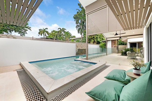 Comfortable loungers invite you to soak up the sunshine before cooling off in the private pool.