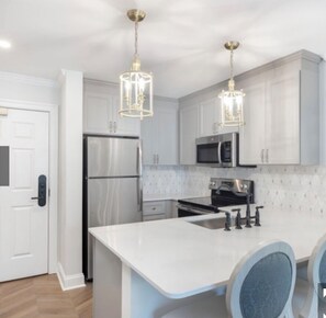 Mini-fridge, microwave, oven, stovetop