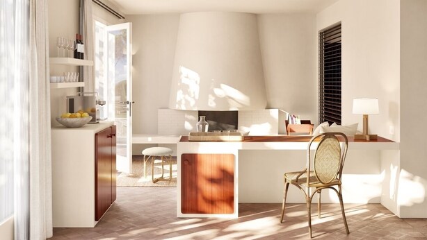 A modern kitchen with a central island, a dining area with a chair, and a window with blinds. - Finca Victoria Hotel & Spa (Begur)