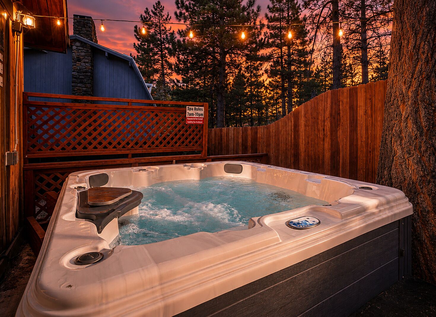A hot tub with a wooden deck and a sign indicating spa rules.