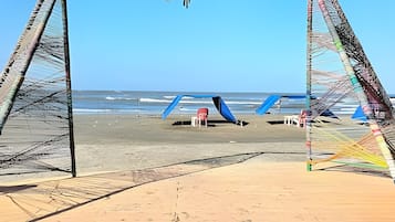 Enjoy leisure activities in this expansive beachside area, offering stunning ocean views.