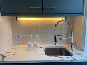 Appartement Deluxe, salle de bains attenante (F4) | Cuisine partagée