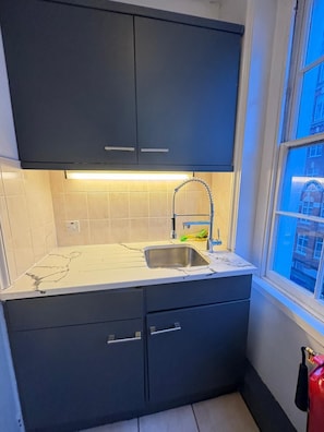 Suite familiar, baño en la habitación | Cocina privada