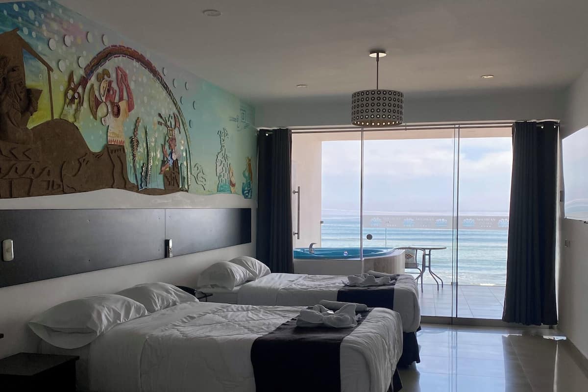 Habitación junior doble, vistas a la playa | Ropa de cama de alta calidad y minibar