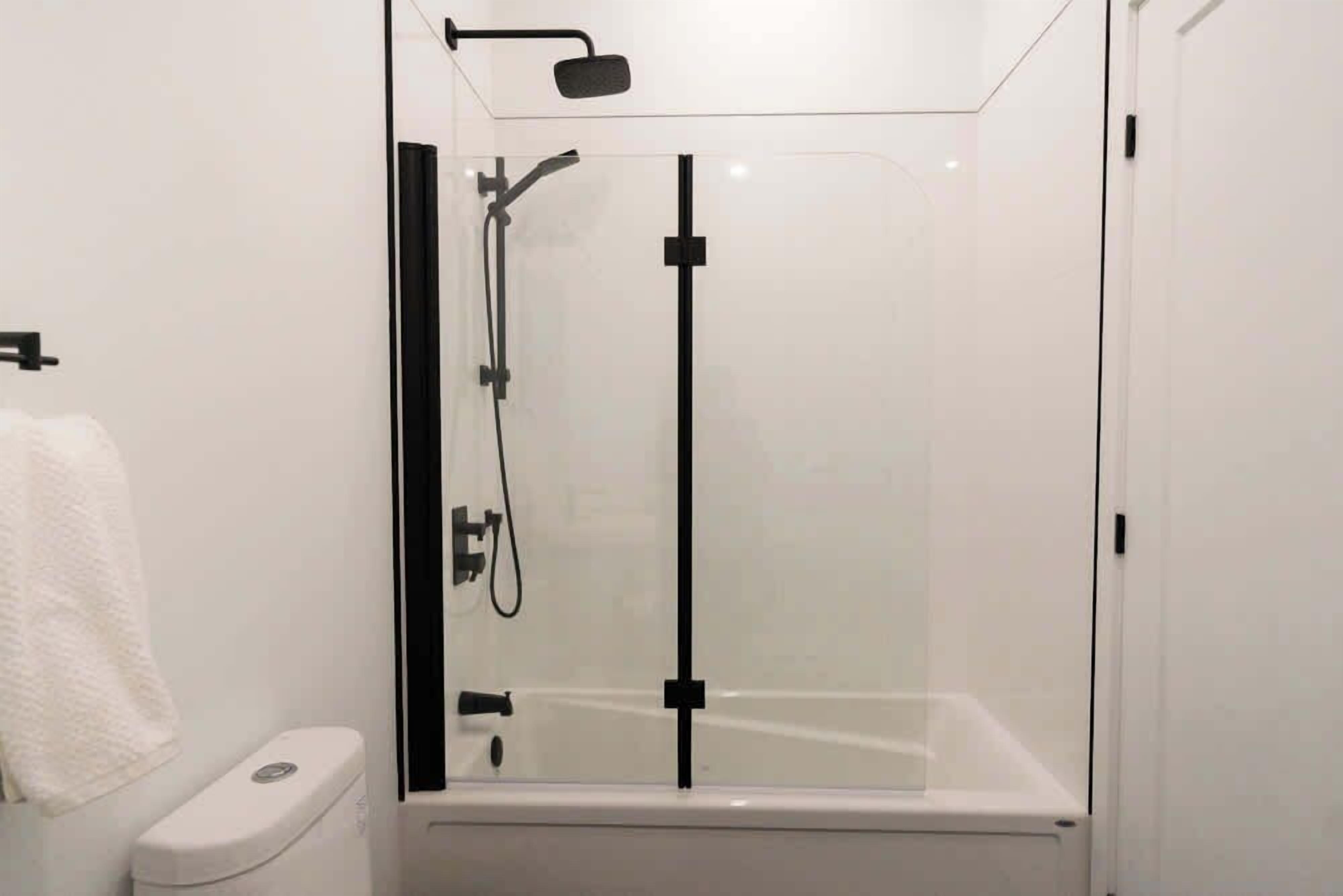 Shower, hair dryer, towels, shampoo