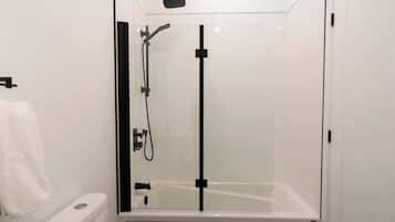 Shower, hair dryer, towels, shampoo