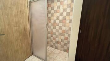 Shower, towels, soap, toilet paper