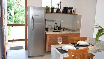 Fridge, coffee/tea maker, cookware/dishes/utensils