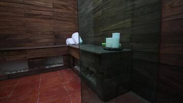 Relax in this serene bathroom with a bench for sitting and a shelf for essentials.
