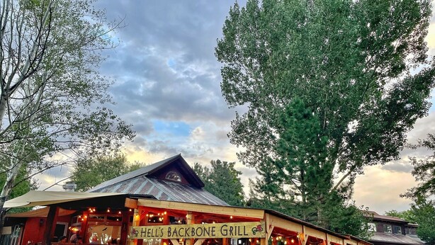 A rustic wooden building with a sign reading "HELL'S BACKBONE GRILL". - Boulder Mountain Lodge (Boulder)