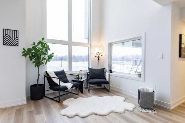 Cozy reading corner with floor-to-ceiling views