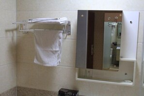 A bathroom with a towel rack, a mirror, and a small shelf. - Qixian 168 Express Hotel (Qi County)
