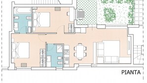 A floor plan of a hotel room with a bathroom, a kitchenette, a dining area, and a small garden.