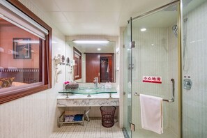 A bathroom with a glass shower, a marble sink, and a towel rack. - Jinye Hotel (zhanggongqiao Food Street) (Leshan)
