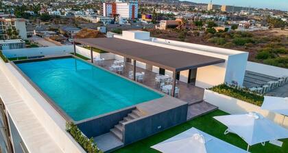 New Luxe Condo steps from Medano Beach!