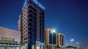 A hotel with a prominent 'Four Points' sign, a modern facade, and a well-lit entrance. - Four Points By Sheraton Jeddah King Fahd Road (Jeddah)