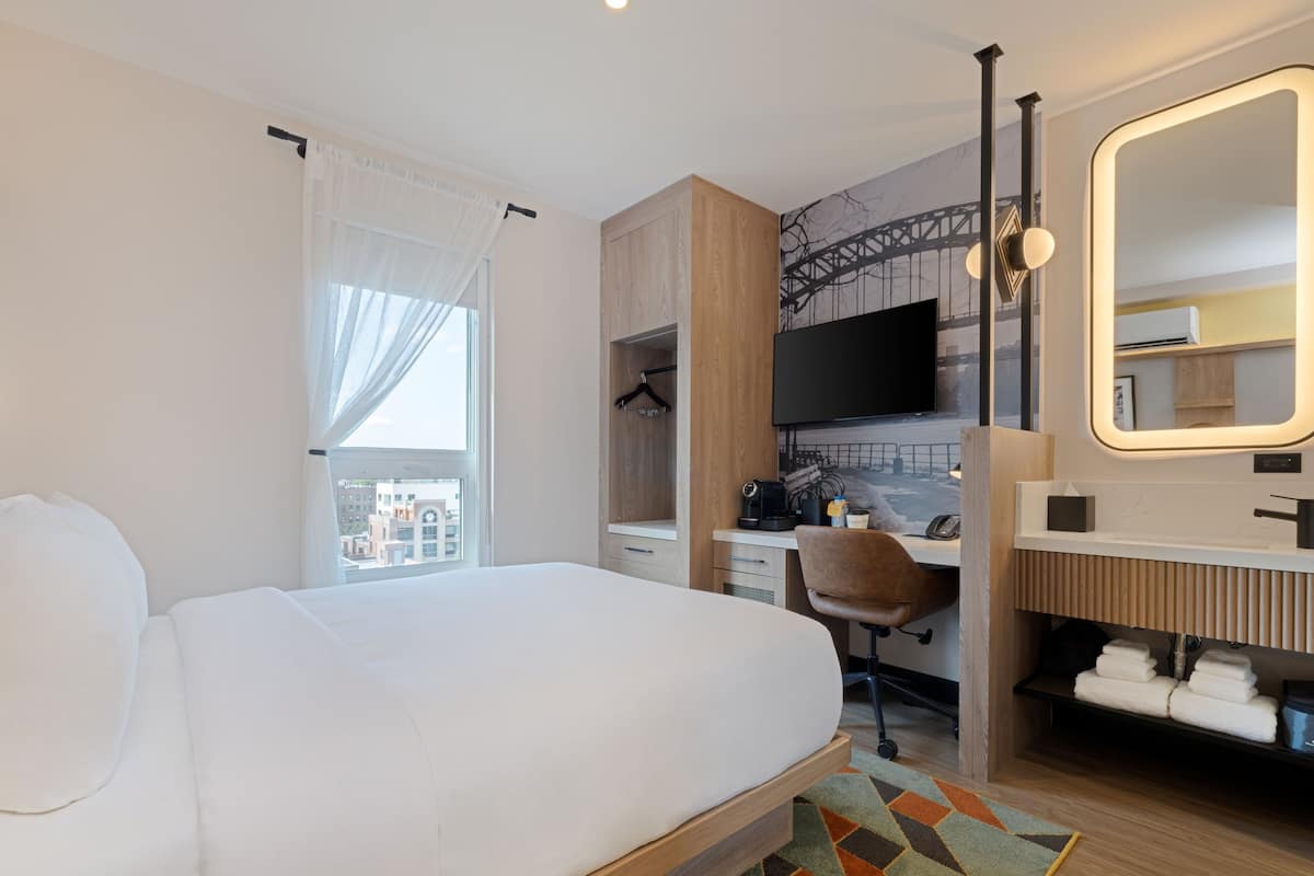 Grand Room, 1 Queen Bed, City View | Desk, laptop workspace, blackout drapes, iron/ironing board